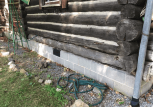 How Do You Repair or Replace Damaged Logs or Wooden Beams in a Cottage?